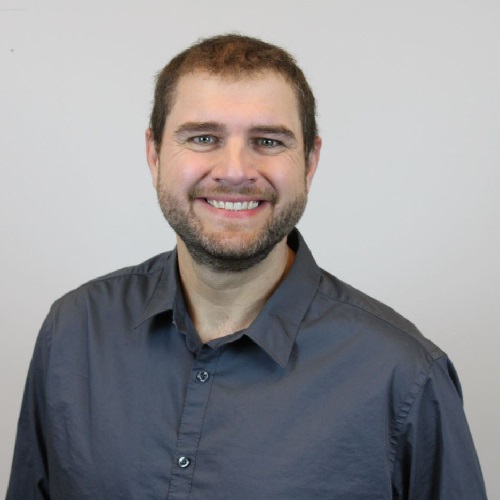 Sean smiles at the camera after weight loss
