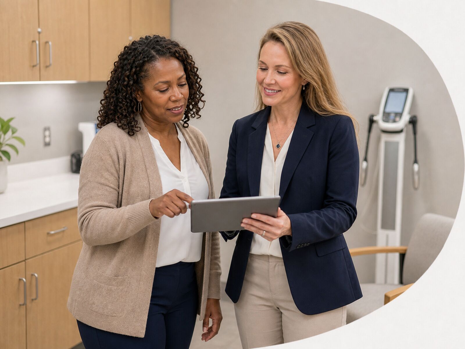 Patient reviewing medical weight loss progress with Dr. Julie Brogren in a clinic